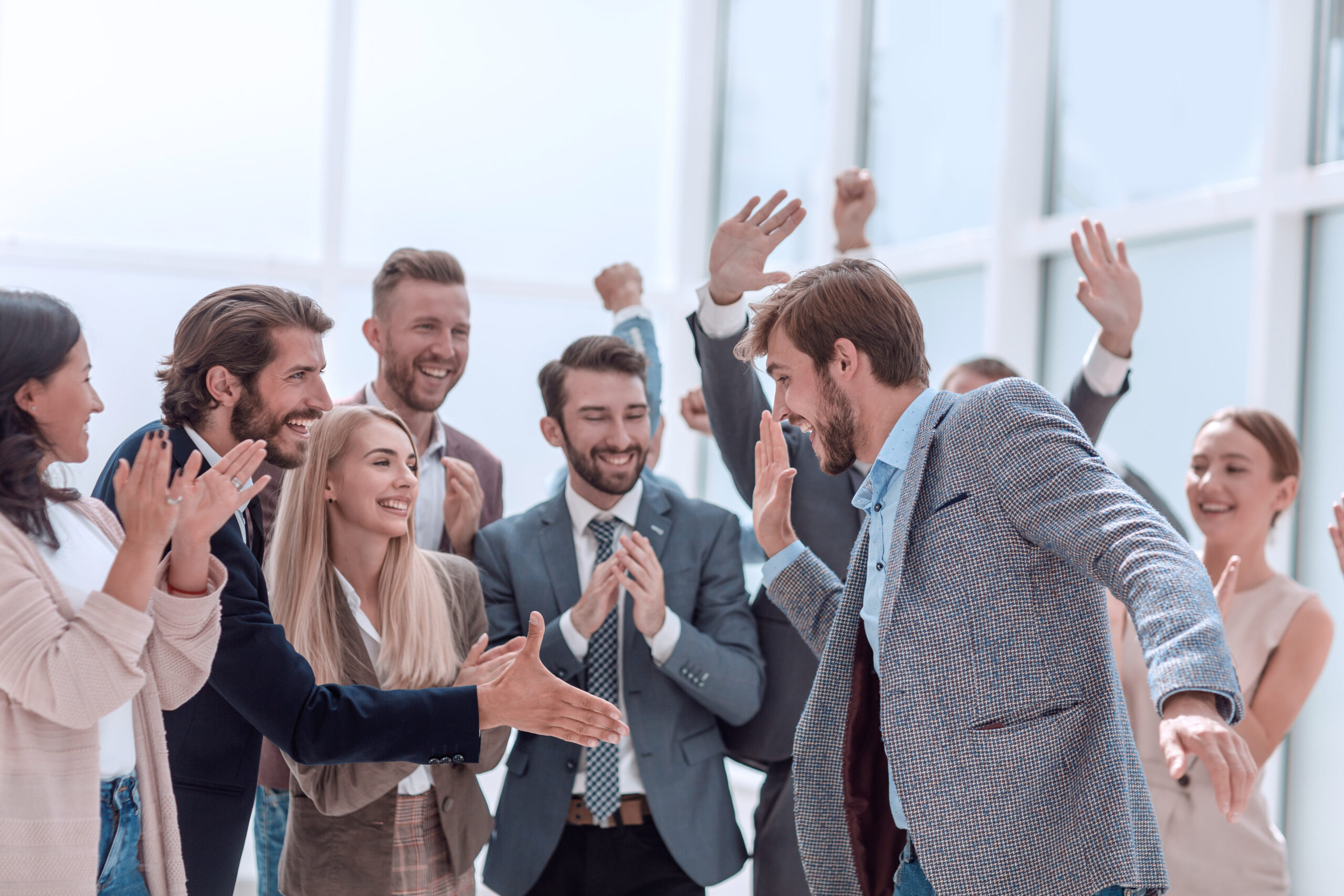 Corporate,Group,Of,Employees,Congratulating,Their,Colleague.